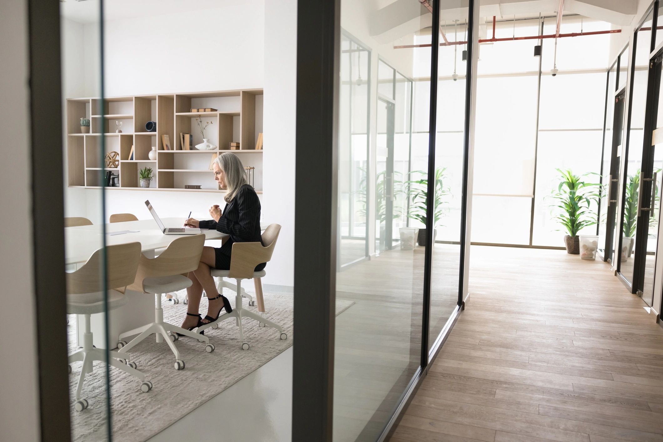 Business owner working thoughtfully in a modern office